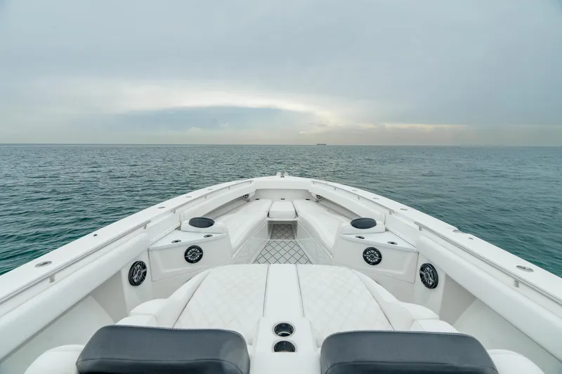 Slide: The Image of Bow view of 2021 HCB Suenos boat on open sea under cloudy sky. - 36