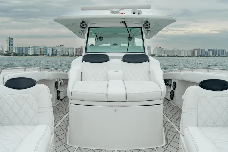 Slide: The Image of 2021 HCB Suenos boat interior with luxurious white seating and ocean view. - 41