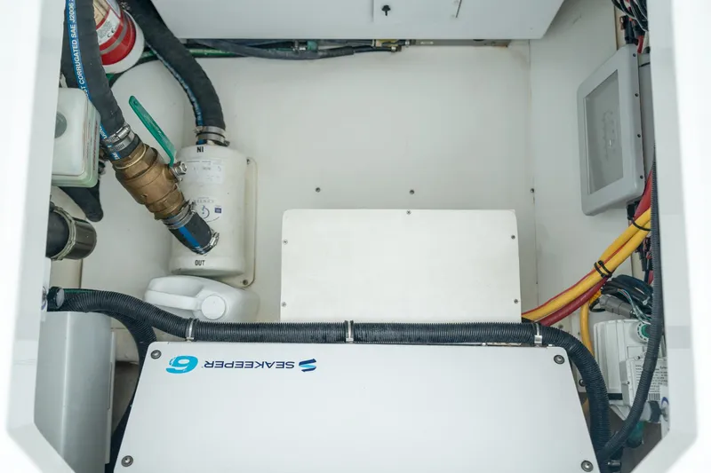 Slide: The Image of Engine compartment of 2021 HCB Suenos boat with Seakeeper system and wiring. - 42