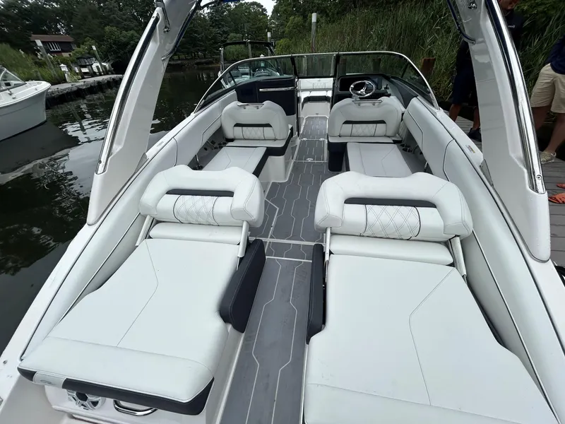 Slide: The Image of 2026 Regal LX4 boat interior with luxurious white seating and sleek design. - 3
