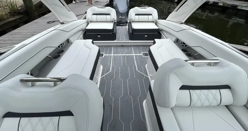 Slide: The Image of Luxurious interior of 2026 Regal LX4 boat with white seating and sleek design. - 7