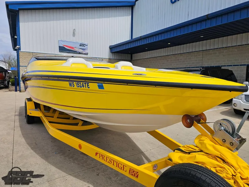 Slide: The Image of Yellow 2006 Advantage 28 Victory Bowrider on trailer, parked outside a building. - 11