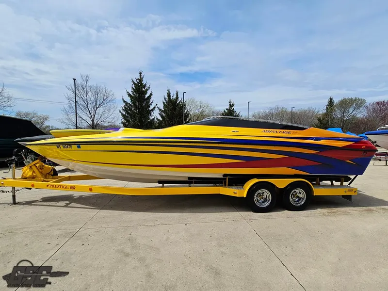 Slide: The Image of 2006 Advantage 28 Victory Bowrider in vibrant yellow and blue on a trailer. - 19