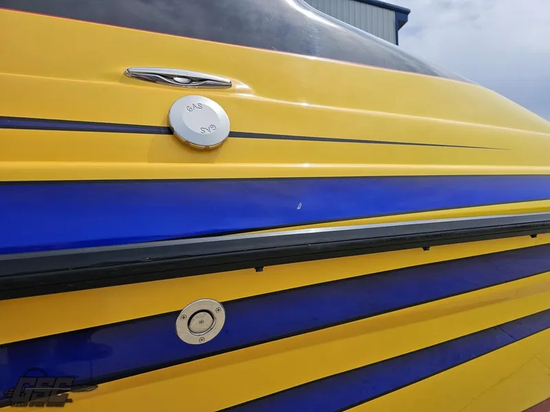 Slide: The Image of 2006 Advantage 28 Victory Bowrider, yellow and blue exterior, close-up view. - 35