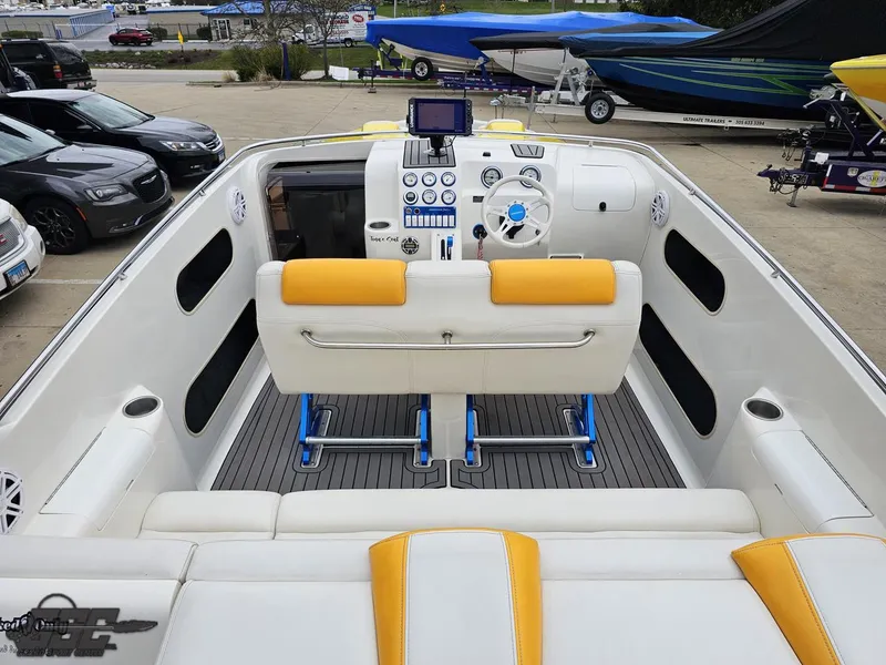 Slide: The Image of 2006 Advantage 28 Victory Bowrider with yellow and white seating, modern dashboard, and steering wheel. - 46