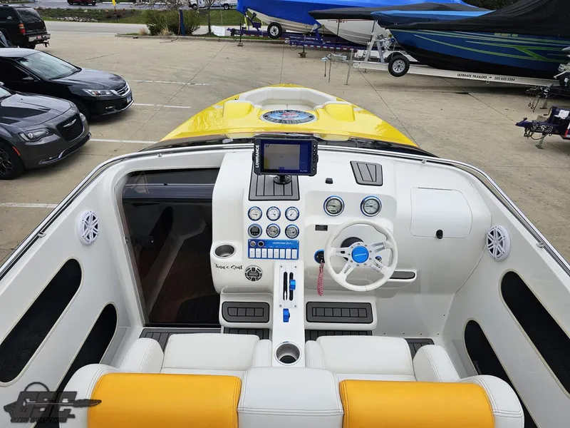 Slide: The Image of 2006 Advantage 28 Victory Bowrider cockpit with yellow accents and modern controls. - 48