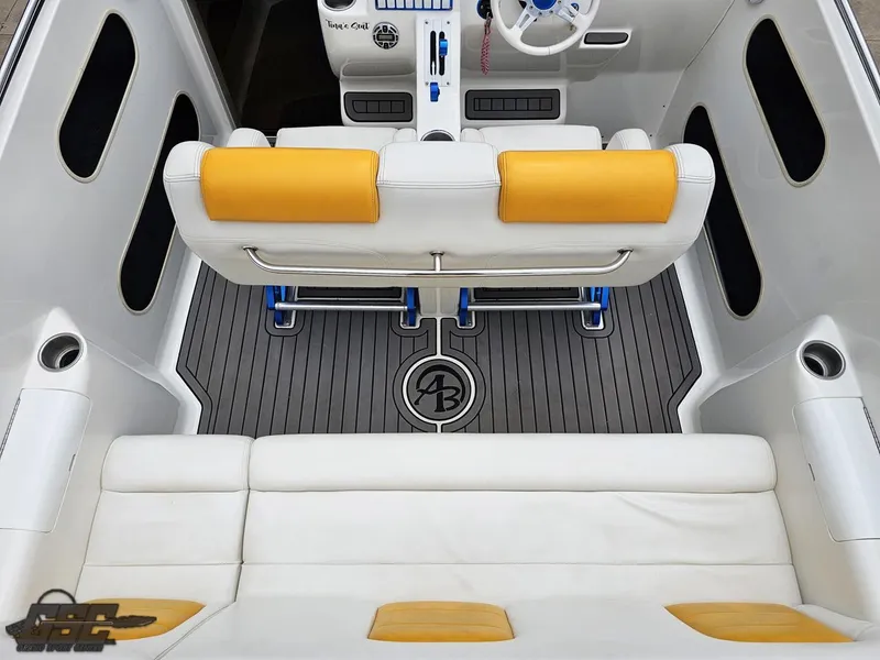 Slide: The Image of 2006 Advantage 28 Victory Bowrider interior with yellow accents and sleek design. - 49