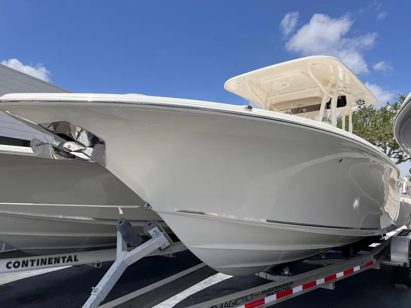The Image of 2025 Key West 260 CC boat on trailer under clear blue sky. - 1
