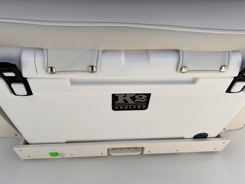 Slide: The Image of K2 cooler on 2025 Key West 260 CC boat, white seat cushion above. - 12