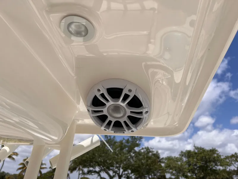 Slide: The Image of 2025 Key West 260 CC boat speaker and light fixture under canopy. - 20