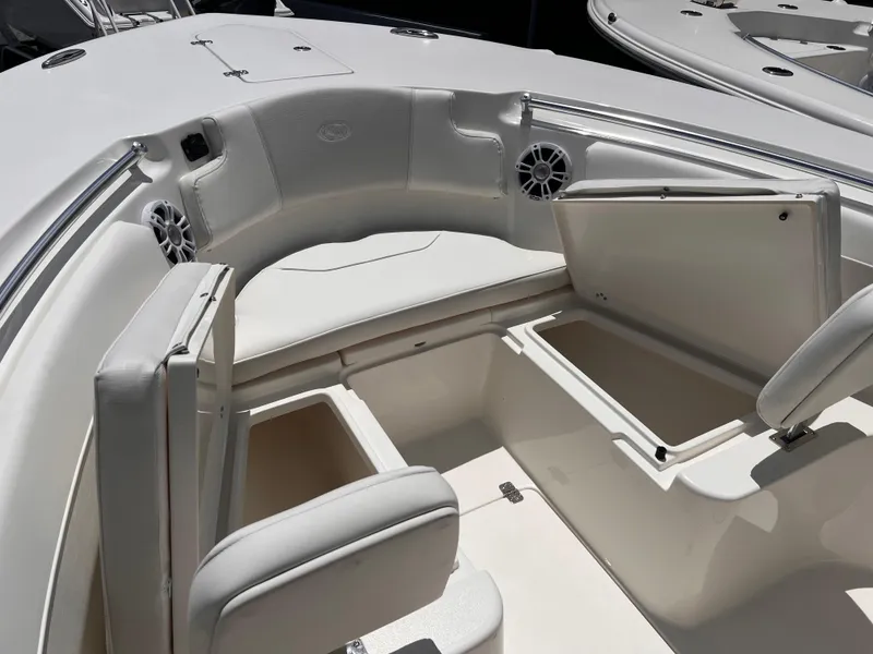 Slide: The Image of 2025 Key West 260 CC boat interior with open storage compartments and seating. - 23
