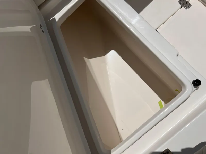 Slide: The Image of 2025 Key West 260 CC boat storage compartment, open and empty. - 24