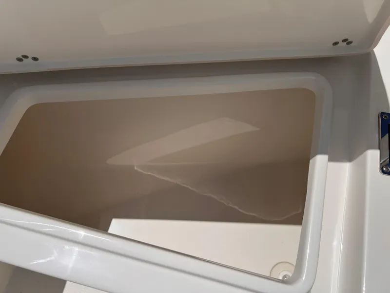 Slide: The Image of Storage compartment of 2025 Key West 260 CC boat, featuring a clean, spacious interior. - 25