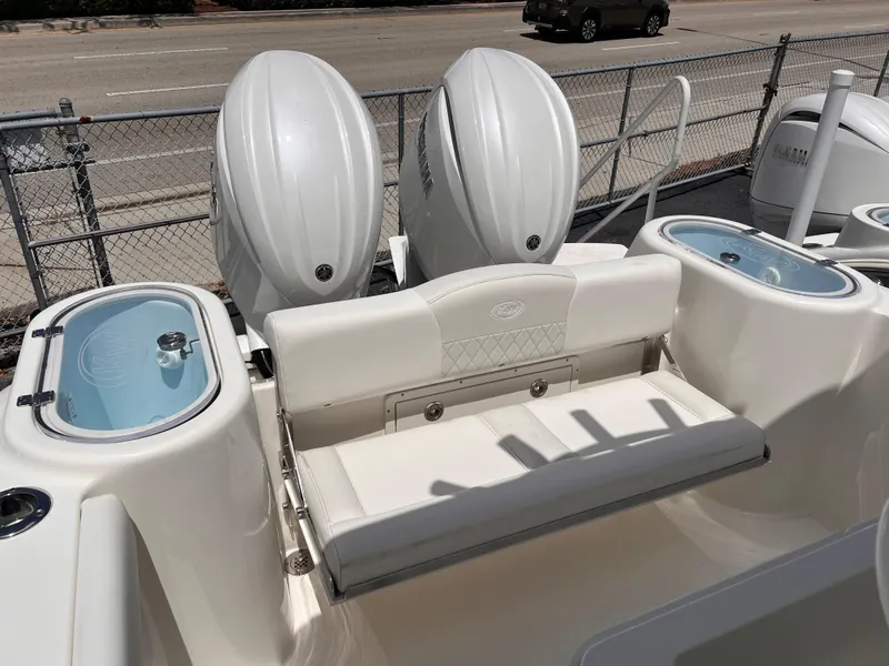 Slide: The Image of 2025 Key West 260 CC boat with dual outboard engines and seating area. - 6