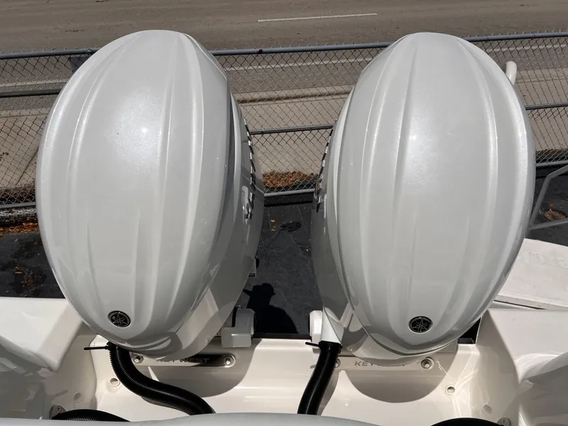 Slide: The Image of Twin outboard motors on a 2025 Key West 260 CC boat, viewed from above. - 7