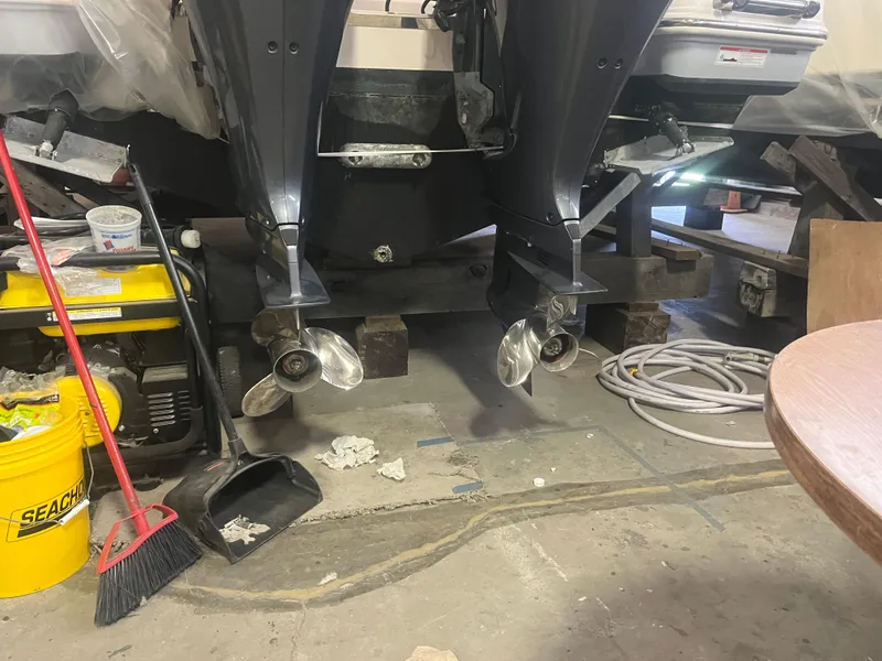 Slide: The Image of 2021 Robalo R272 Center Console boat engines in a workshop setting. - 23