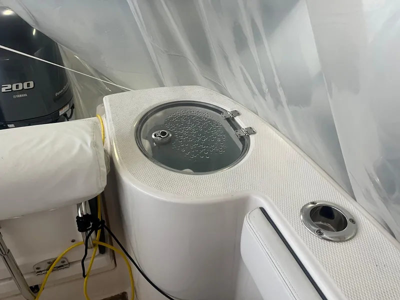 Slide: The Image of 2021 Robalo R272 Center Console boat with livewell and Yamaha 200 engine. - 33