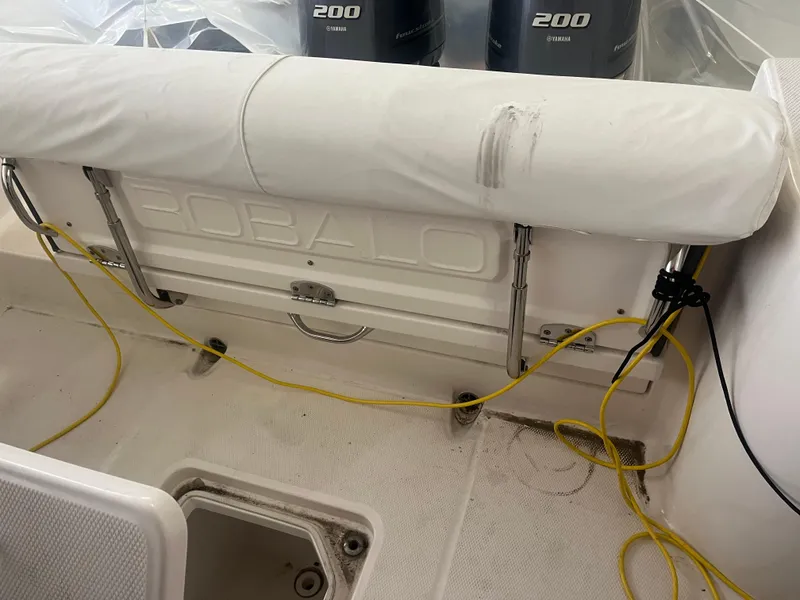 Slide: The Image of 2021 Robalo R272 Center Console boat interior with Yamaha 200 engines visible. - 34