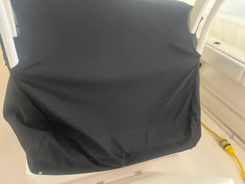 Slide: The Image of 2021 Robalo R272 Center Console with black cover, interior view. - 36