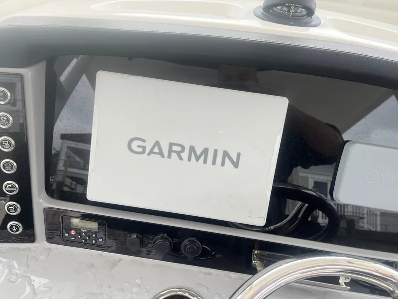 Slide: The Image of Dashboard of 2021 Robalo R272 Center Console with Garmin navigation system. - 48