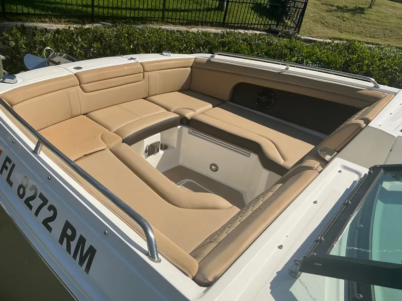 Slide: The Image of 2018 Sea Ray SDX 290 Outboard boat with tan seating and sleek design. - 12
