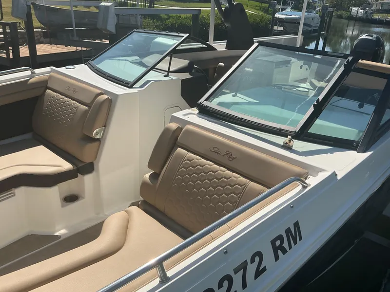Slide: The Image of 2018 Sea Ray SDX 290 Outboard boat with tan seating and dual windshields. - 13