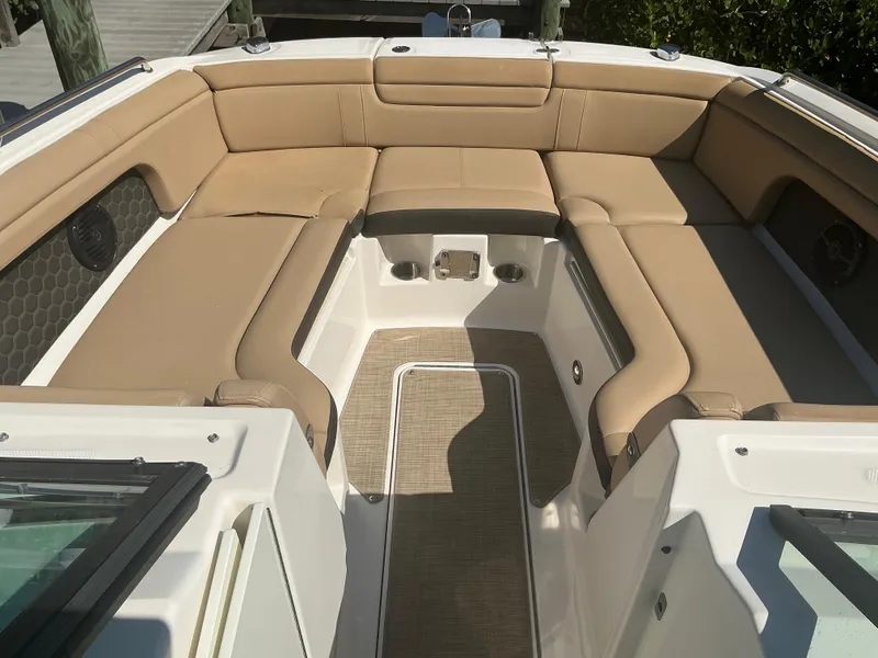 Slide: The Image of 2018 Sea Ray SDX 290 Outboard boat with tan seating and spacious deck area. - 16