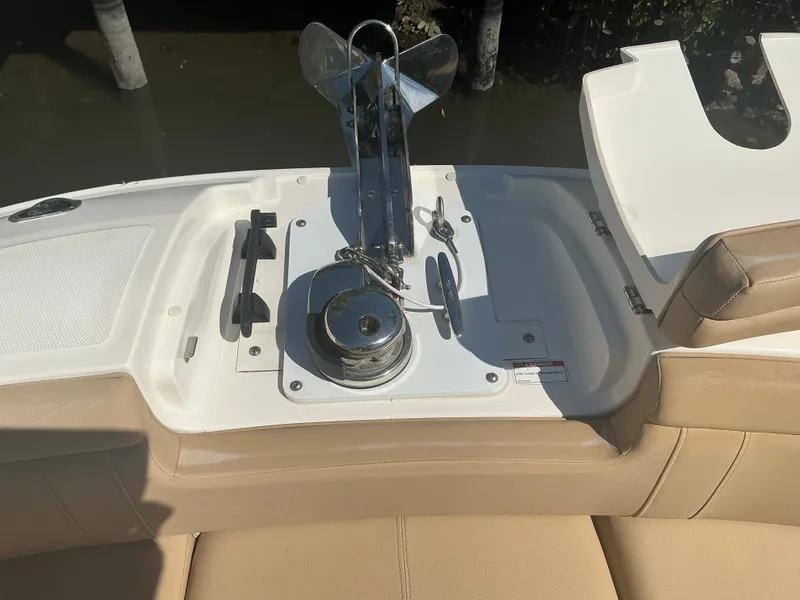 Slide: The Image of 2018 Sea Ray SDX 290 Outboard boat anchor system on beige seating area. - 32