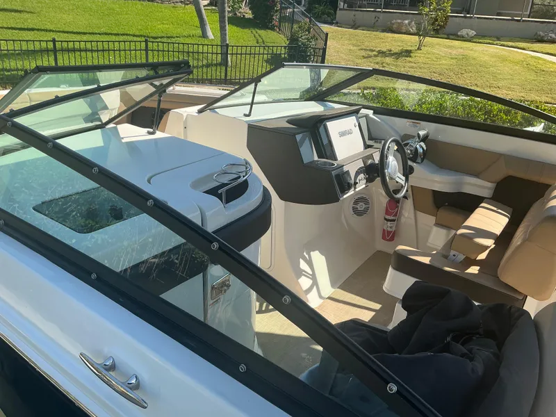 Slide: The Image of 2018 Sea Ray SDX 290 Outboard boat interior with modern dashboard and seating. - 9