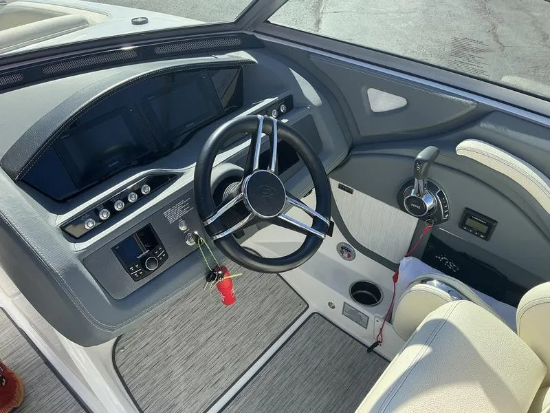 Slide: The Image of 2021 Cobalt R7 boat cockpit with steering wheel and control panel. - 8