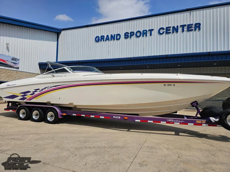 Slide: The Image of 1999 Powerquest 380 Avenger boat on trailer at Grand Sport Center. - 12