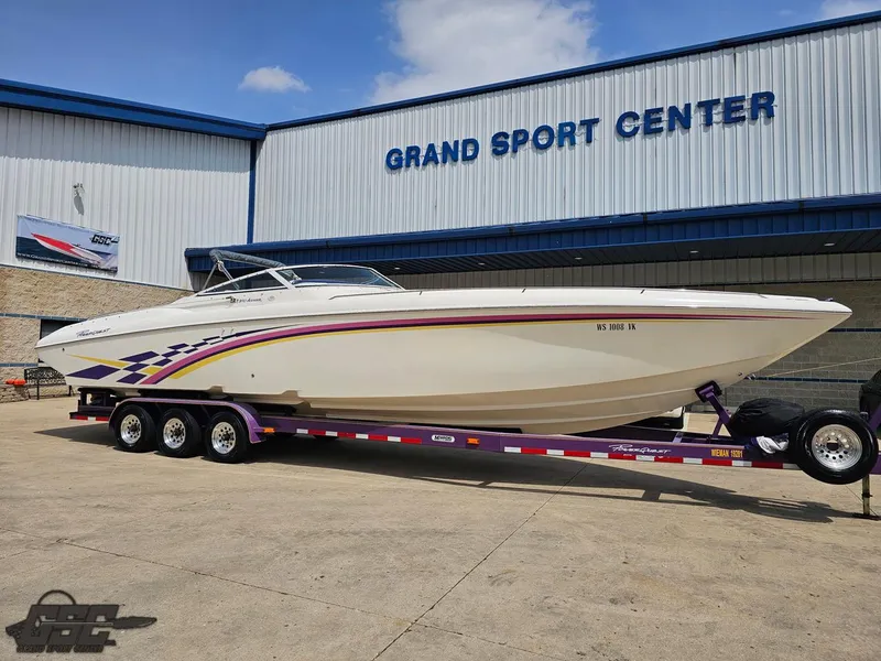 Slide: The Image of 1999 Powerquest 380 Avenger boat on trailer at Grand Sport Center. - 13