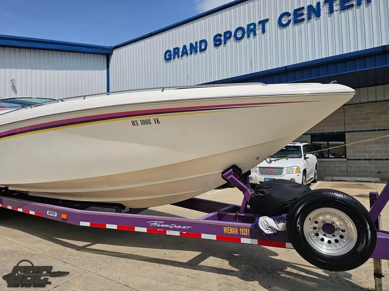 Slide: The Image of 1999 Powerquest 380 Avenger boat on trailer at Grand Sport Center. - 14