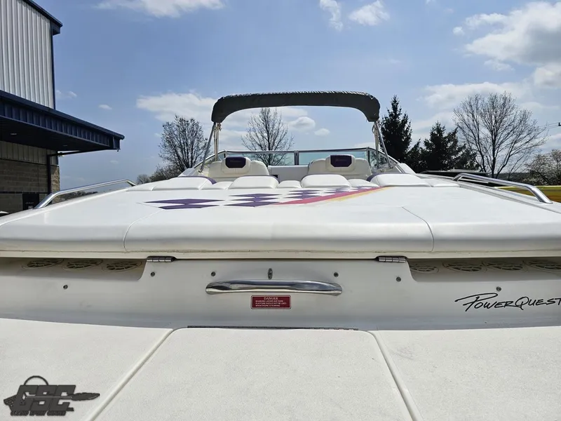 Slide: The Image of 1999 Powerquest 380 Avenger boat, rear view, white exterior, sunny day, outdoor setting. - 29