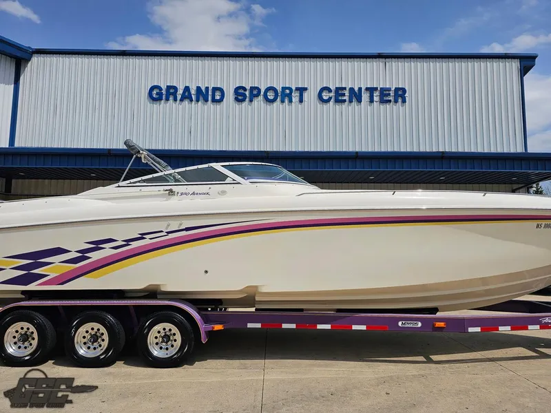 Slide: The Image of 1999 Powerquest 380 Avenger boat on trailer at Grand Sport Center. - 3