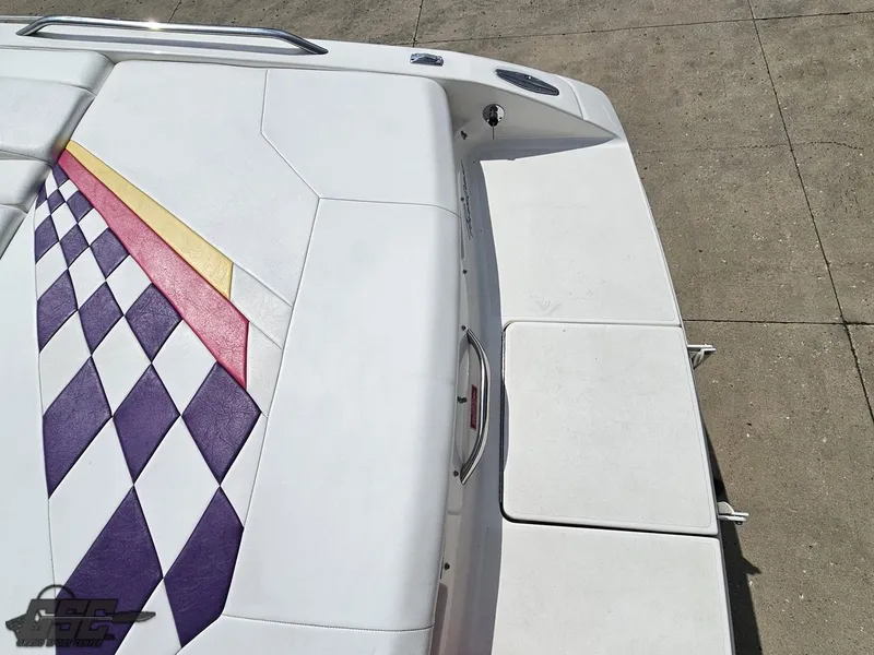 Slide: The Image of 1999 Powerquest 380 Avenger boat with colorful diamond pattern upholstery on deck. - 31