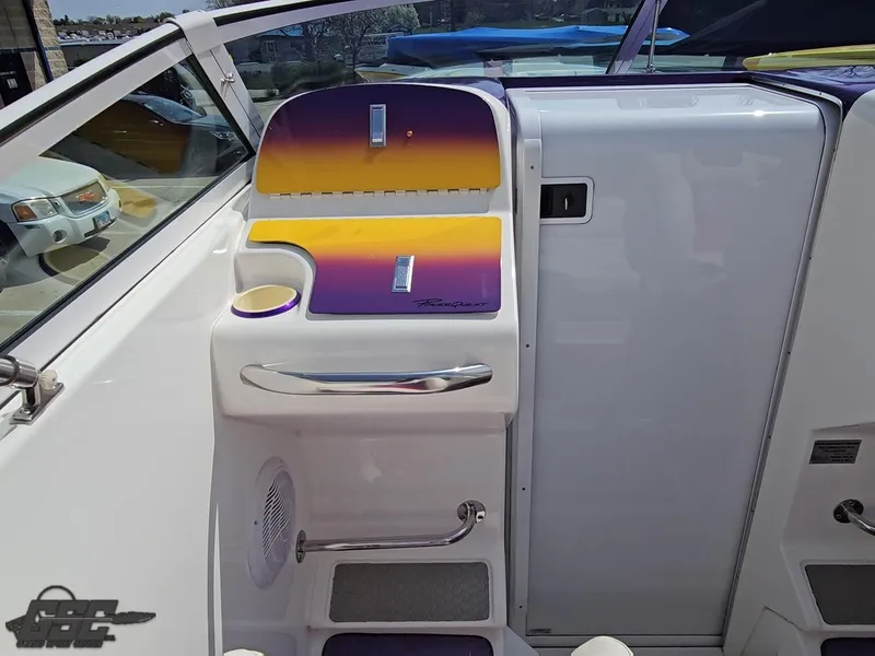 Slide: The Image of 1999 Powerquest 380 Avenger boat interior with vibrant purple and yellow accents. - 48