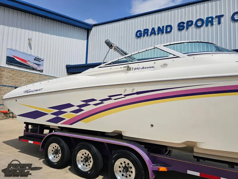 Slide: The Image of 1999 Powerquest 380 Avenger boat with colorful graphics at Grand Sport Center. - 6