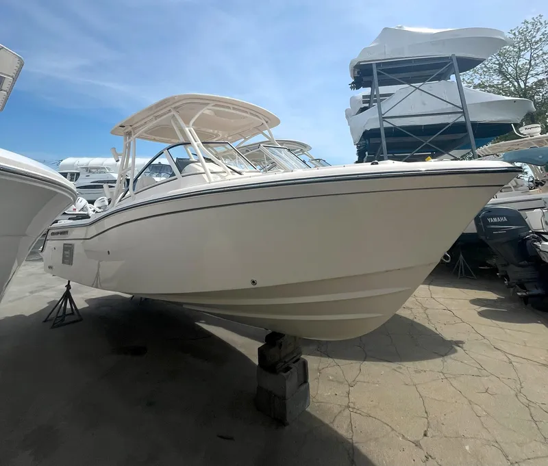 The Image of 2026 Grady-White GW 235 Freedom boat displayed in a marina setting. - 0