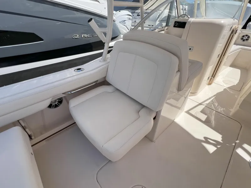 Slide: The Image of Luxury seating on 2026 Grady-White GW 235 Freedom boat interior. - 10