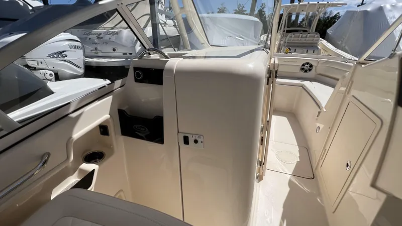 Slide: The Image of 2026 Grady-White GW 235 Freedom boat interior, showcasing seating and helm area. - 17