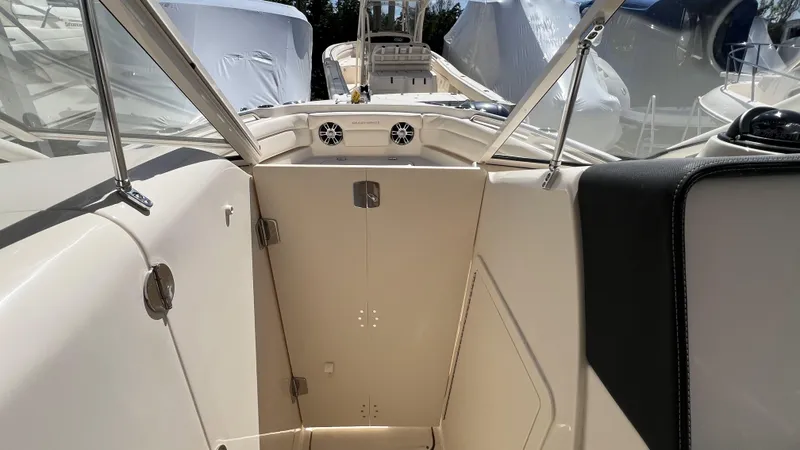Slide: The Image of 2026 Grady-White GW 235 Freedom boat interior with open windshield and seating area. - 19