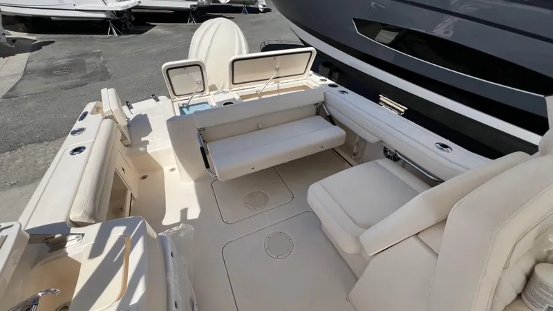 Slide: The Image of 2026 Grady-White GW 235 Freedom boat interior with seating and storage compartments. - 4