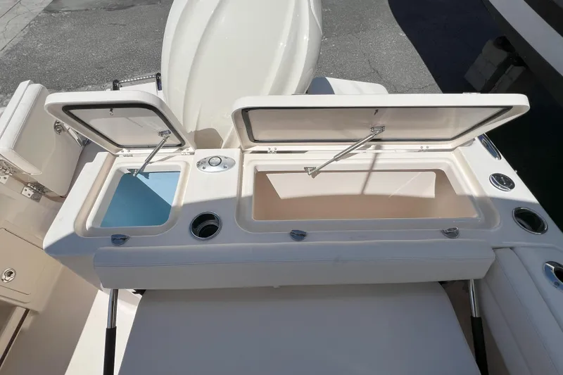 Slide: The Image of 2026 Grady-White GW 235 Freedom boat with open storage compartments. - 6