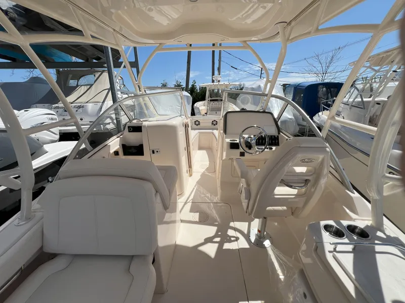 Slide: The Image of 2026 Grady-White GW 235 Freedom boat interior with modern helm and seating. - 7