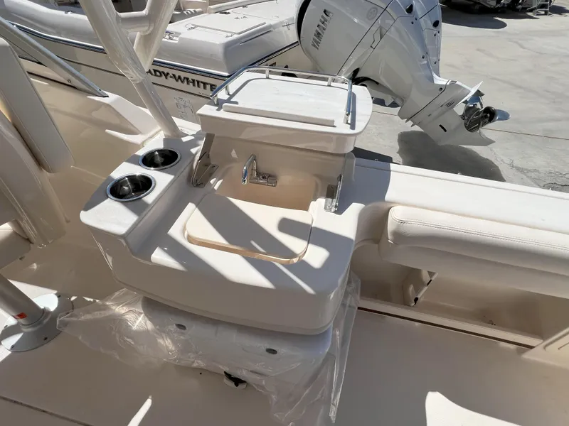 Slide: The Image of 2026 Grady-White GW 235 Freedom boat interior with sink and cup holders. - 8