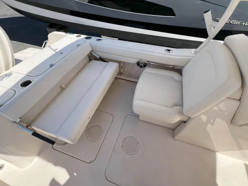 Slide: The Image of 2026 Grady-White GW 235 Freedom boat interior with beige seating and sleek design. - 9