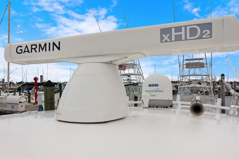 Slide: The Image of Garmin xHD2 radar on 2004 Intrepid 377 Walkaround boat, marina background. - 42