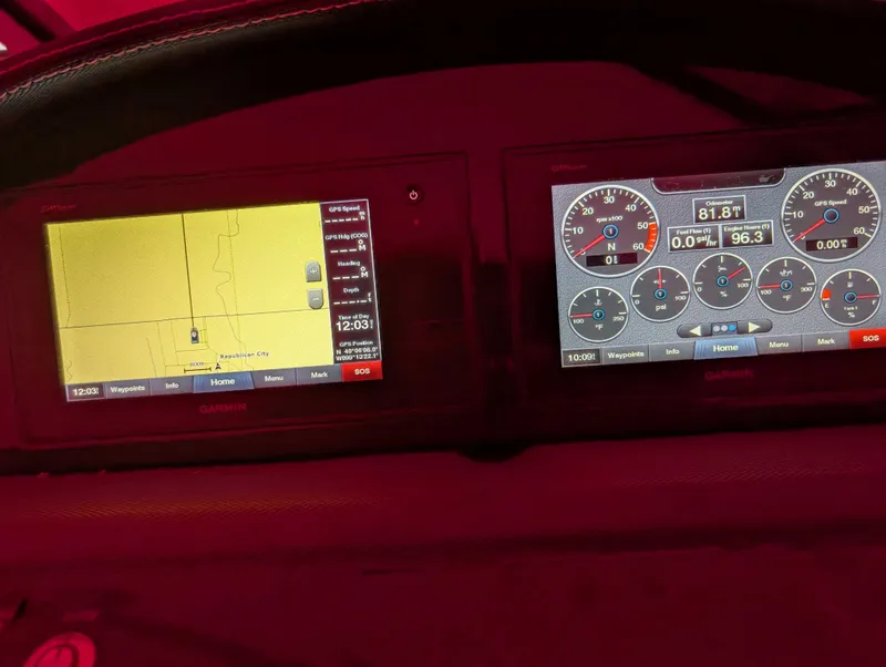 Slide: The Image of Dashboard of a 2019 Cobalt 23 SC boat with navigation and instrument displays. - 6