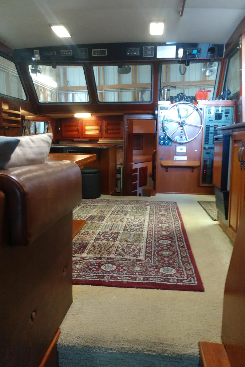 Slide: The Image of Interior of a 1981 Tollycraft 43 Motoryacht with wood paneling and nautical decor. - 14